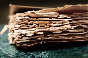 Water-damaged documents with warped edges, showcasing the need for document drying and restoration services in Hawaii.