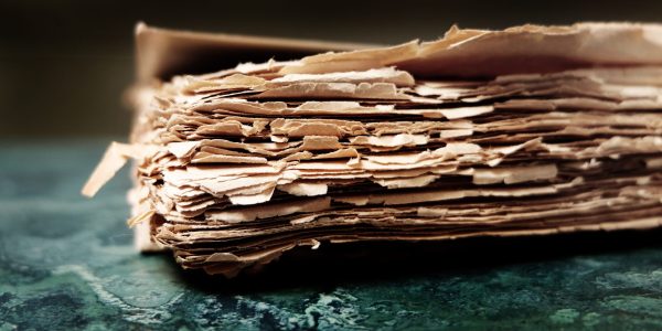 Water-damaged documents with warped edges, showcasing the need for document drying and restoration services in Hawaii.