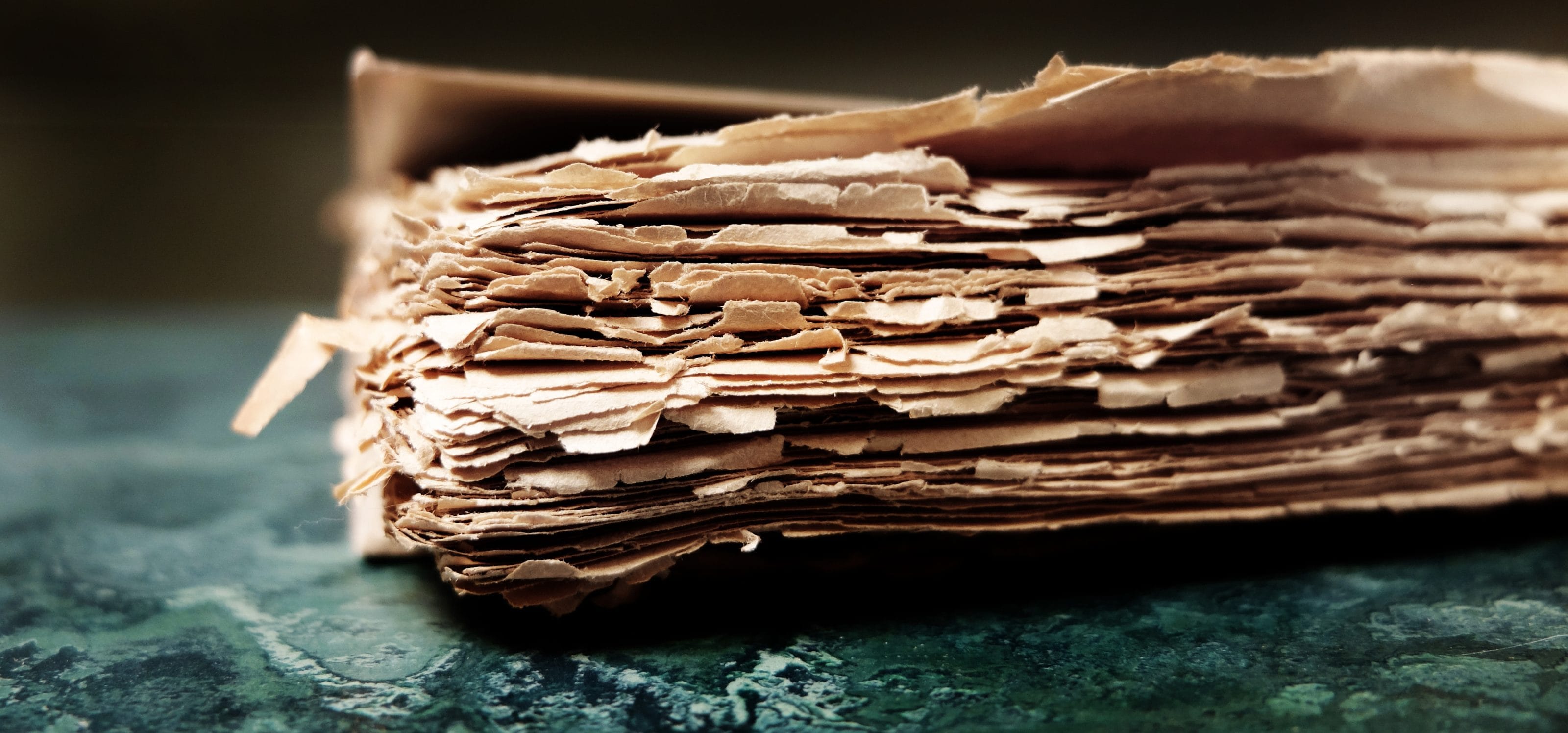 Water-damaged documents with warped edges, showcasing the need for document drying and restoration services in Hawaii.